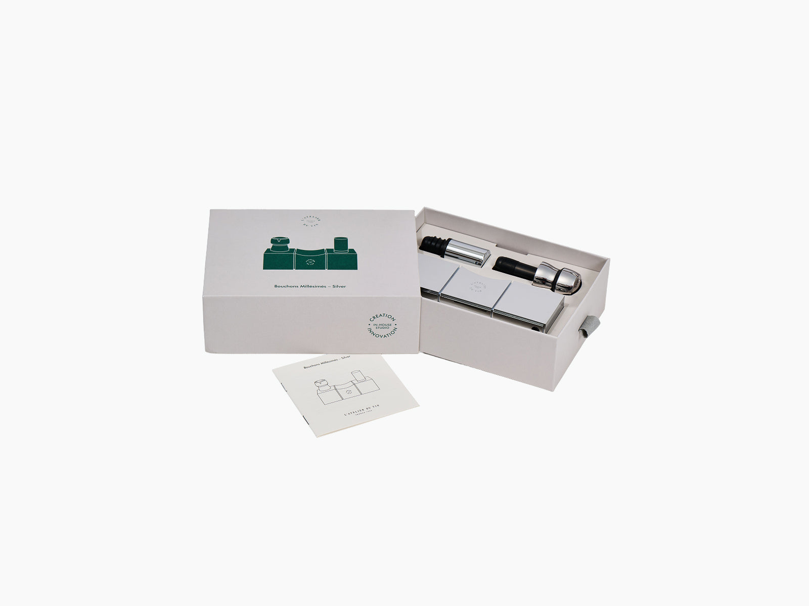 Open presentation box for Bouchons Millésimés Silver showing chrome blocks and corkscrew components neatly arranged inside