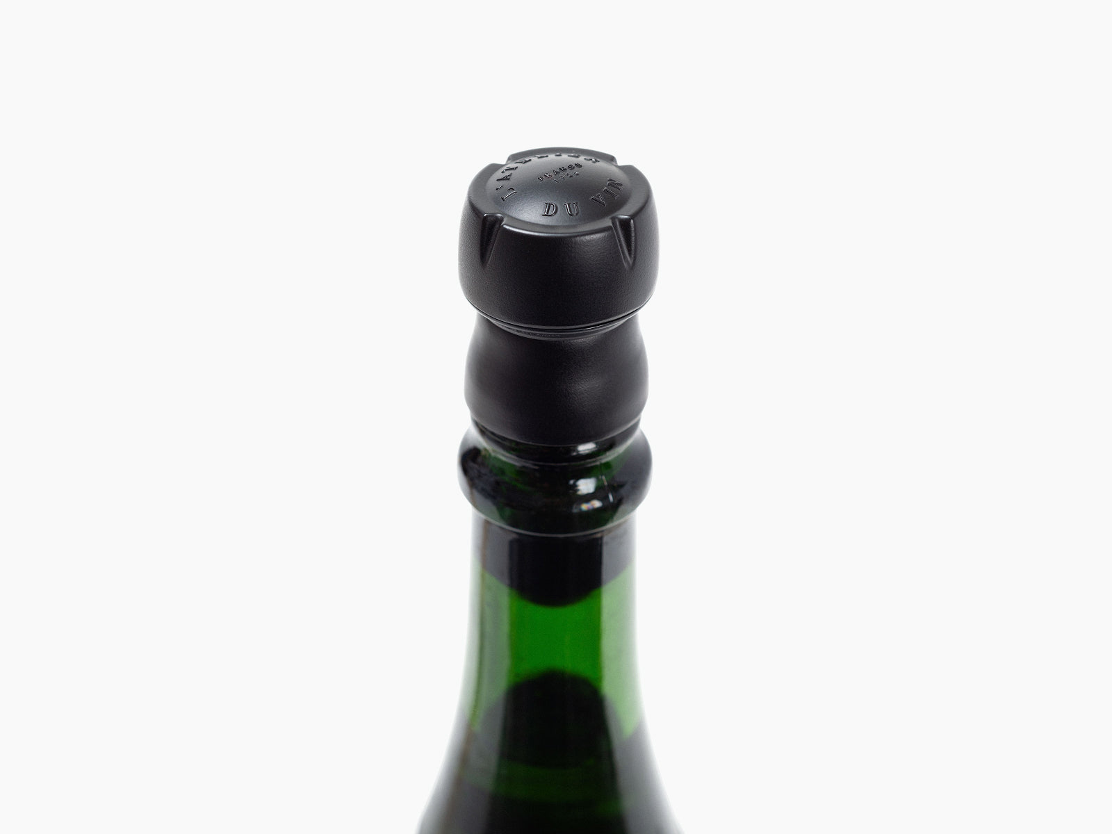 Bubble Cork stopper in black atop a champagne bottle neck