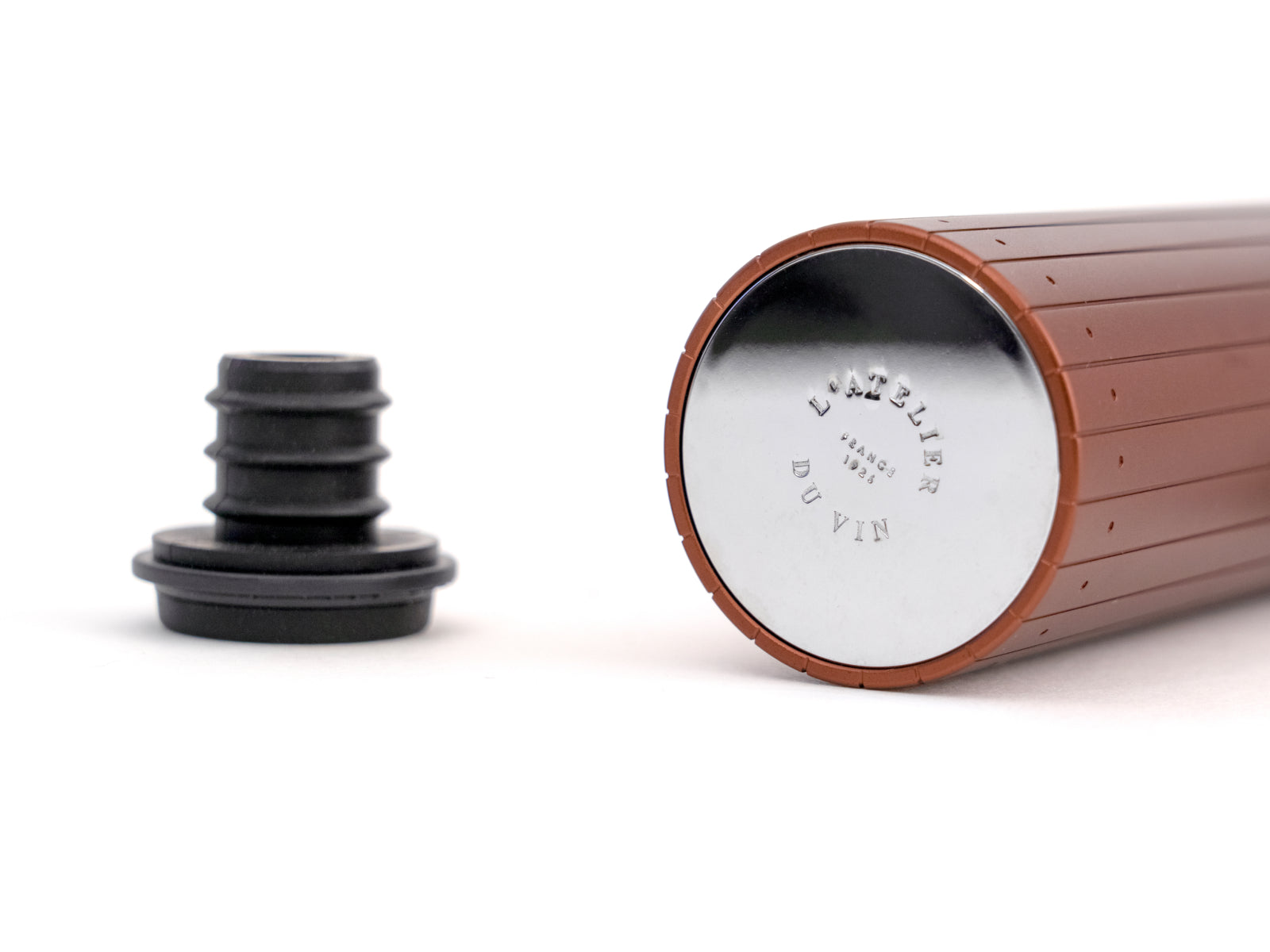 Close-up of copper-red Gard’Vin On/Off Power device with metal end cap and detached black seal adapter