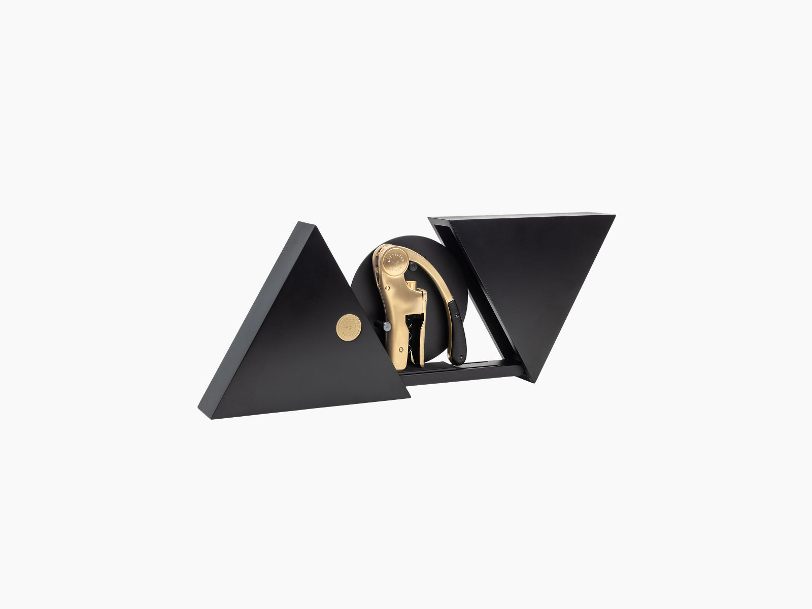 Black lacquered geometric box with the gold Oeno Motion corkscrew displayed between triangular panels.