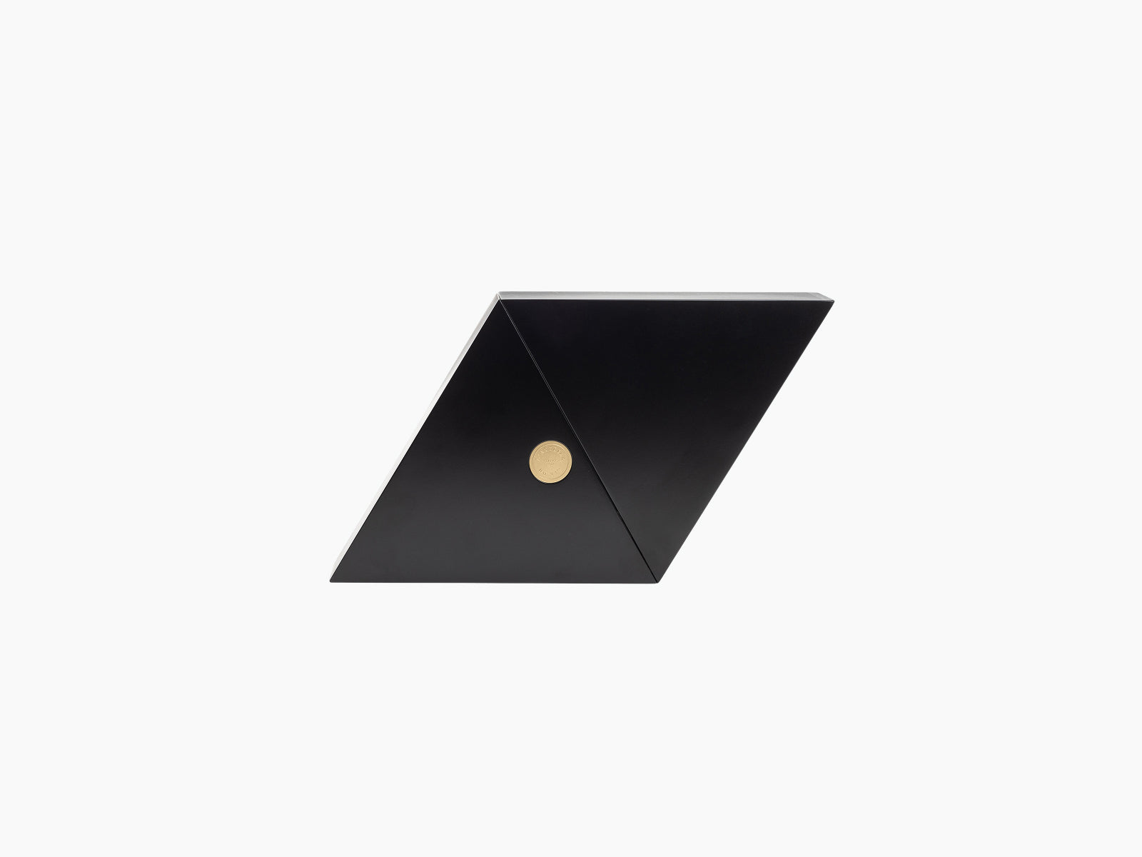 Black geometric box with a diagonal crease and a small gold circular seal on the front for Geometry.