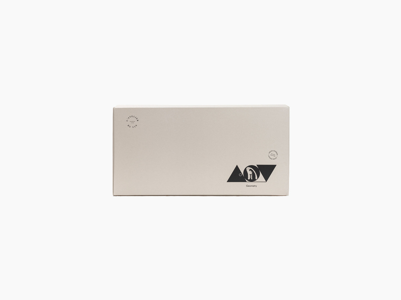 Beige Geometry packaging box featuring a black triangular logo and stamps.