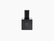 Le Bouchon Black wine stopper on a square base with a circular logo.