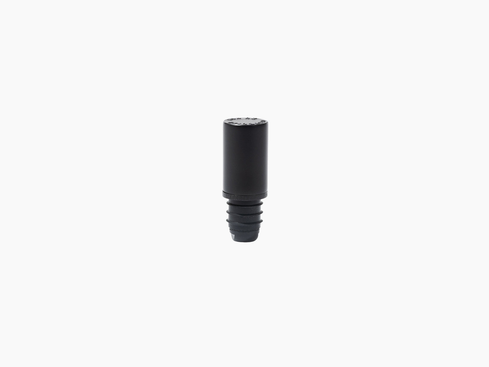 Le Bouchon Black stopper with a threaded base on a white background