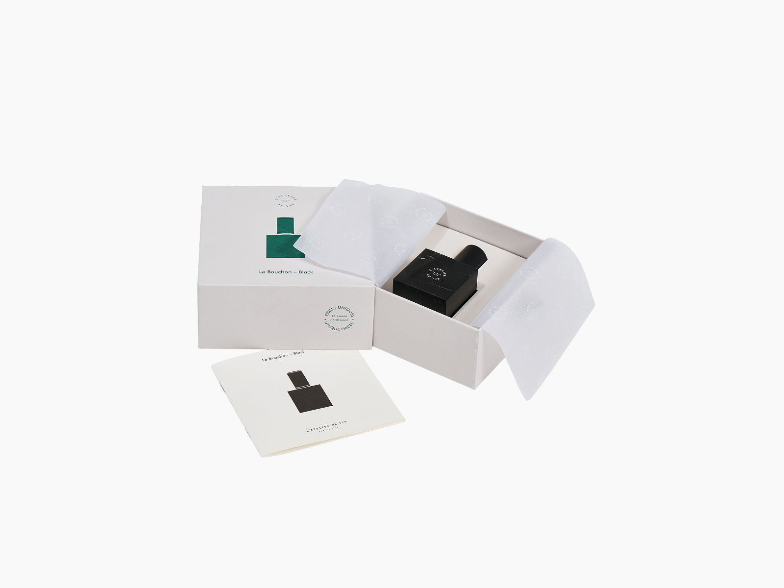 Open gift box showcasing Le Bouchon Black with the stopper inside tissue paper and an instruction card