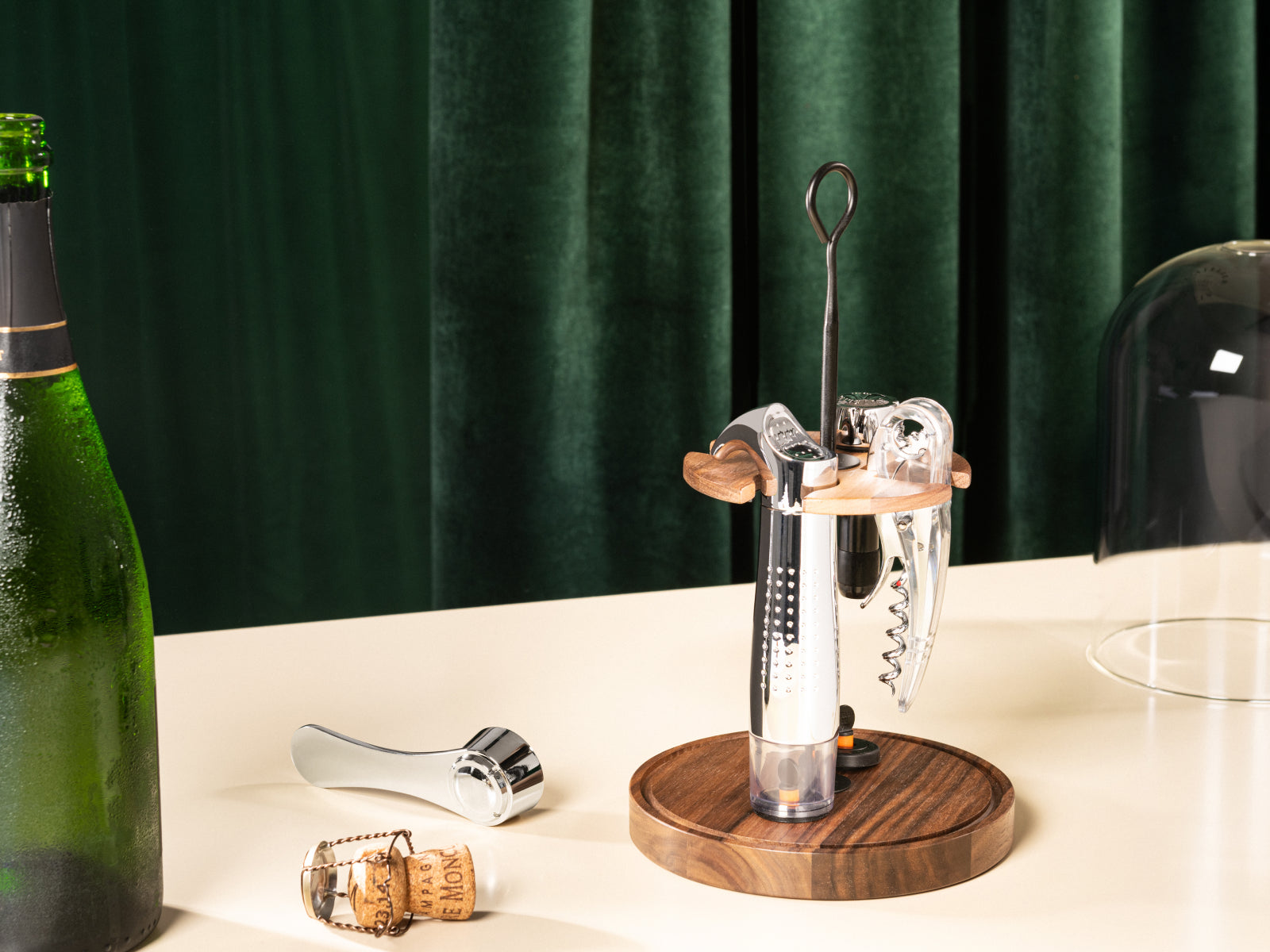 Le Globe wine tasting set displayed on a wooden base with cork opener and metal tools beside a bottle