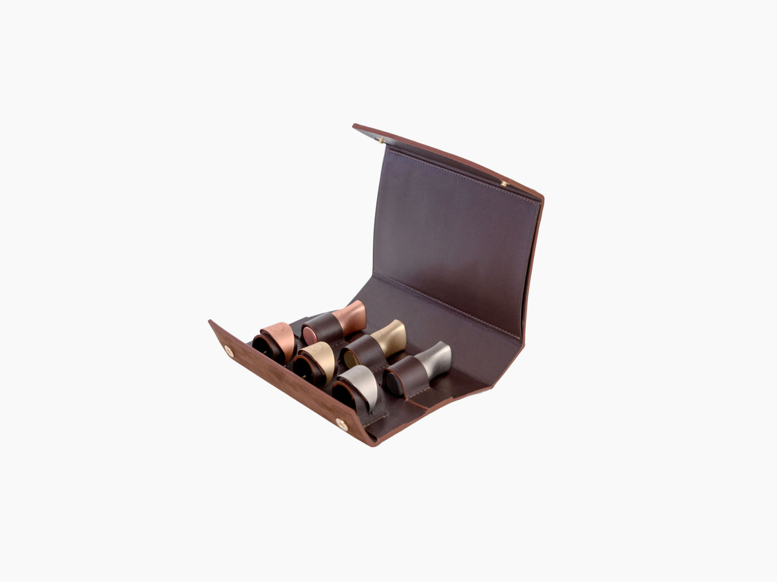 Open leather case with six wine accessories three stoppers and three rings in metallic finishes.