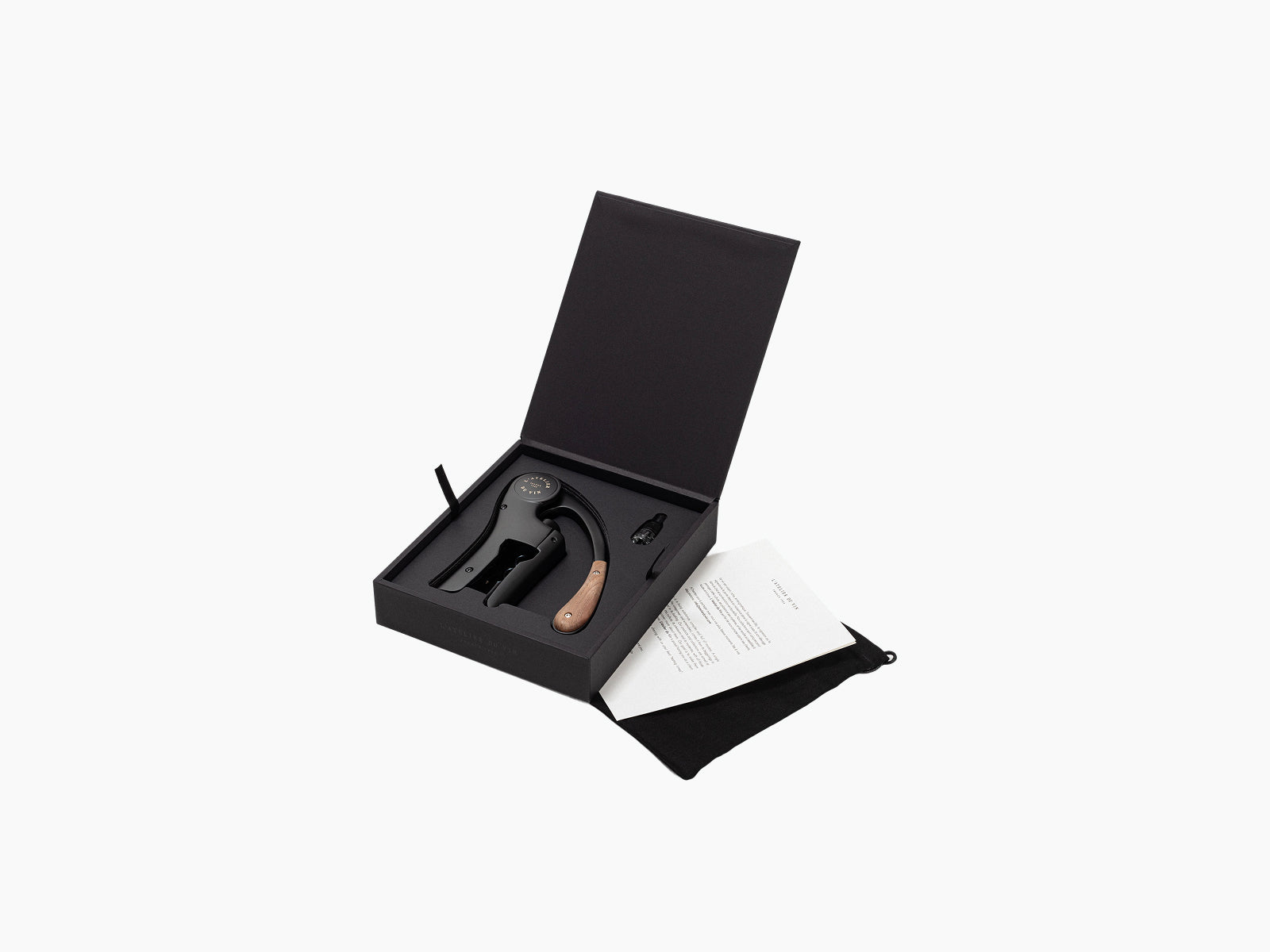 Open black gift box contains the Oeno Motion corkscrew with walnut handle and accessories.