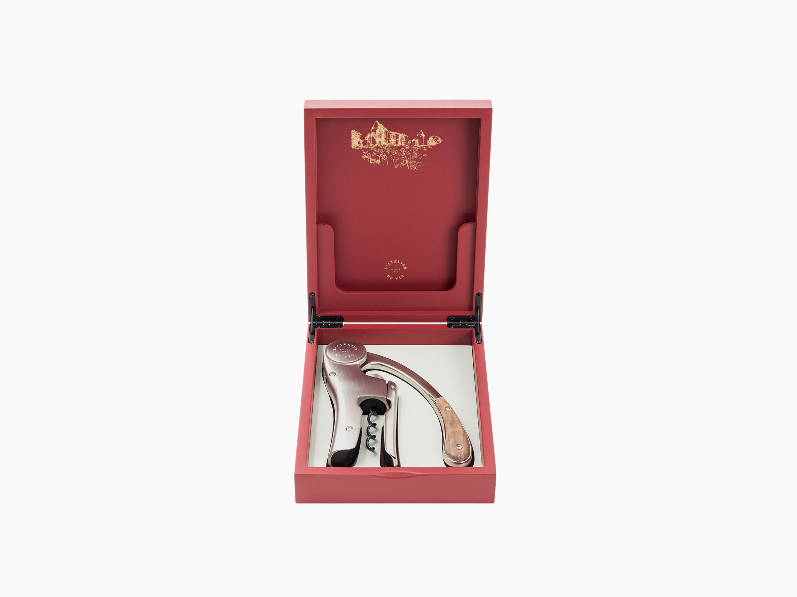 Open red lacquered Oeno Motion Trésor box revealing a silver lever corkscrew inside a white tray.