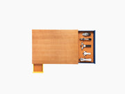 Le Plateau wooden wine tray with yellow side drawer and blue pull-out exposing wine tools on orange lining.