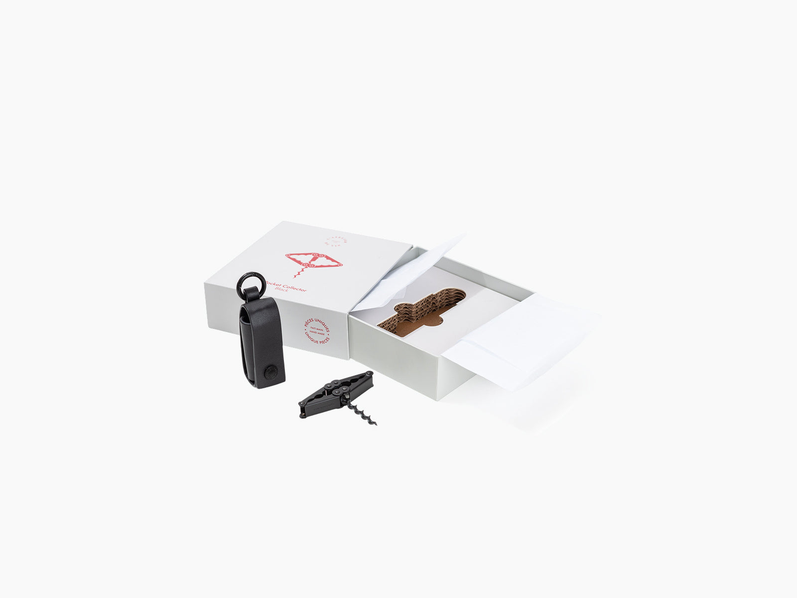 Pocket Collector black corkscrew with matching accessories shown beside an open white gift box.