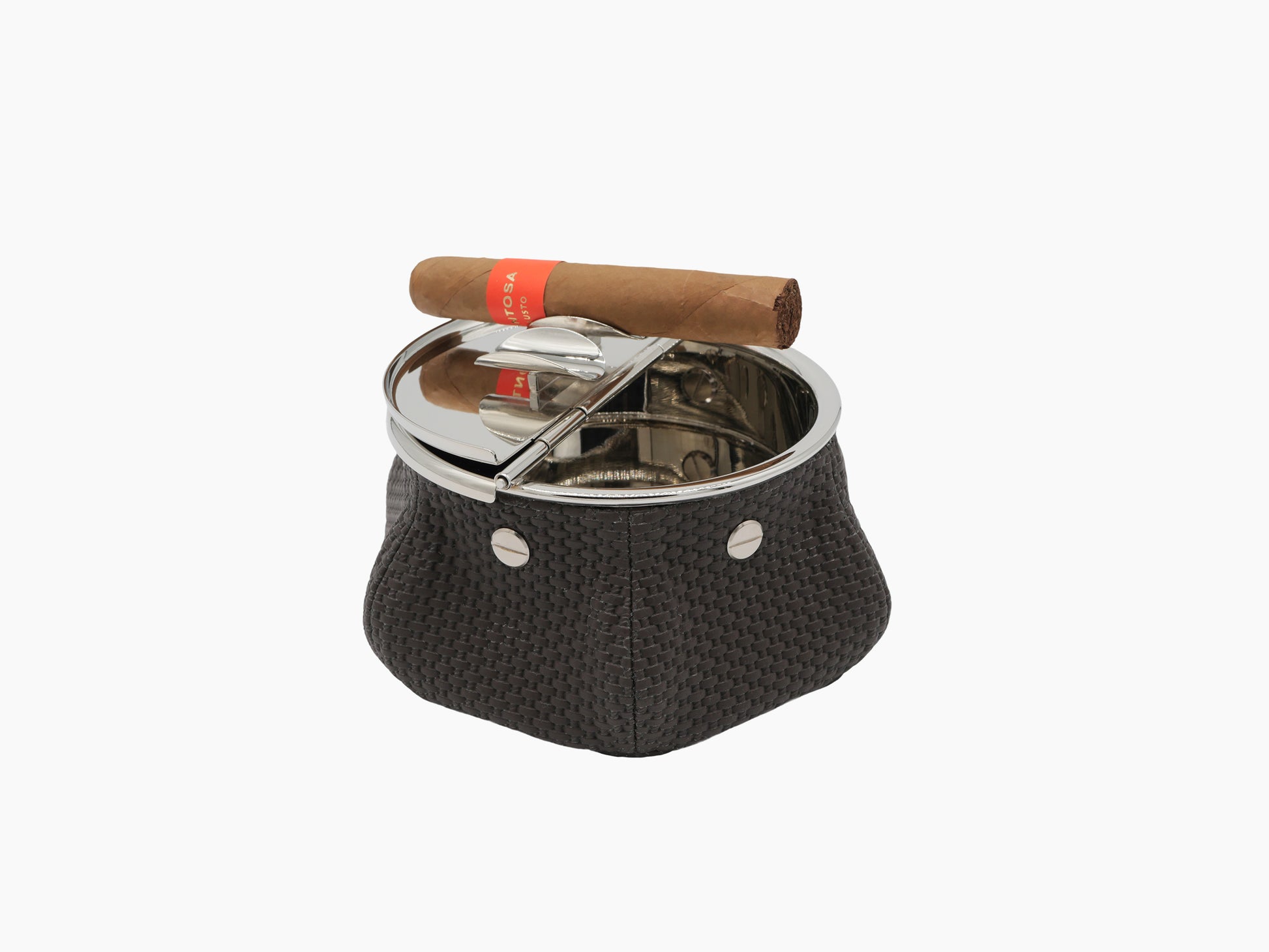 Laurence Bean Bag Ashtray with dark woven leather base and chrome lid, cigar balanced on top.