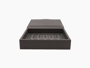 Open Luna Box for Nespresso in dark woven leather with a plexiglass panel holding 30 capsules.