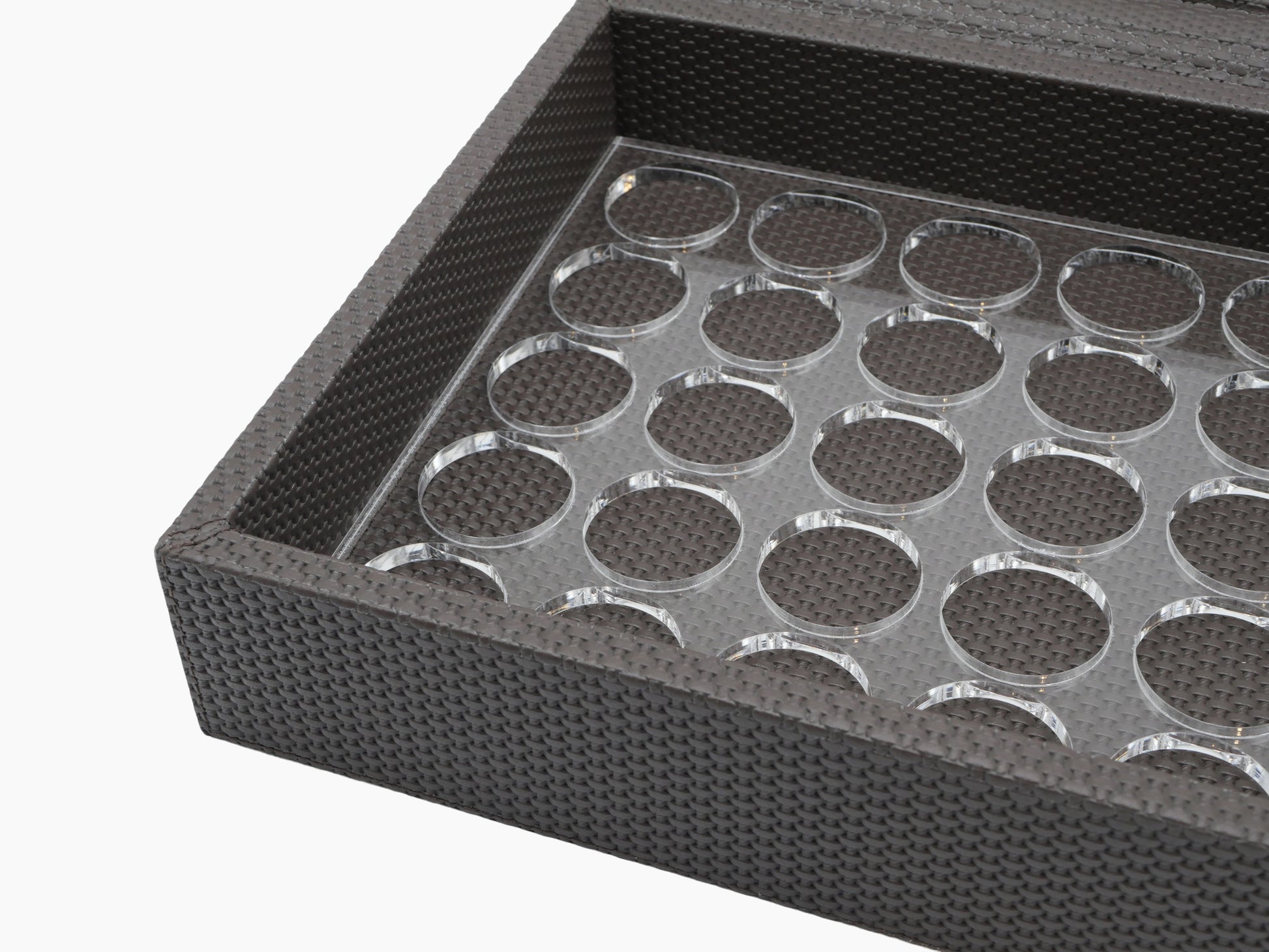 Close up of Luna Box interior with a plexiglass tray and circular capsule slots.