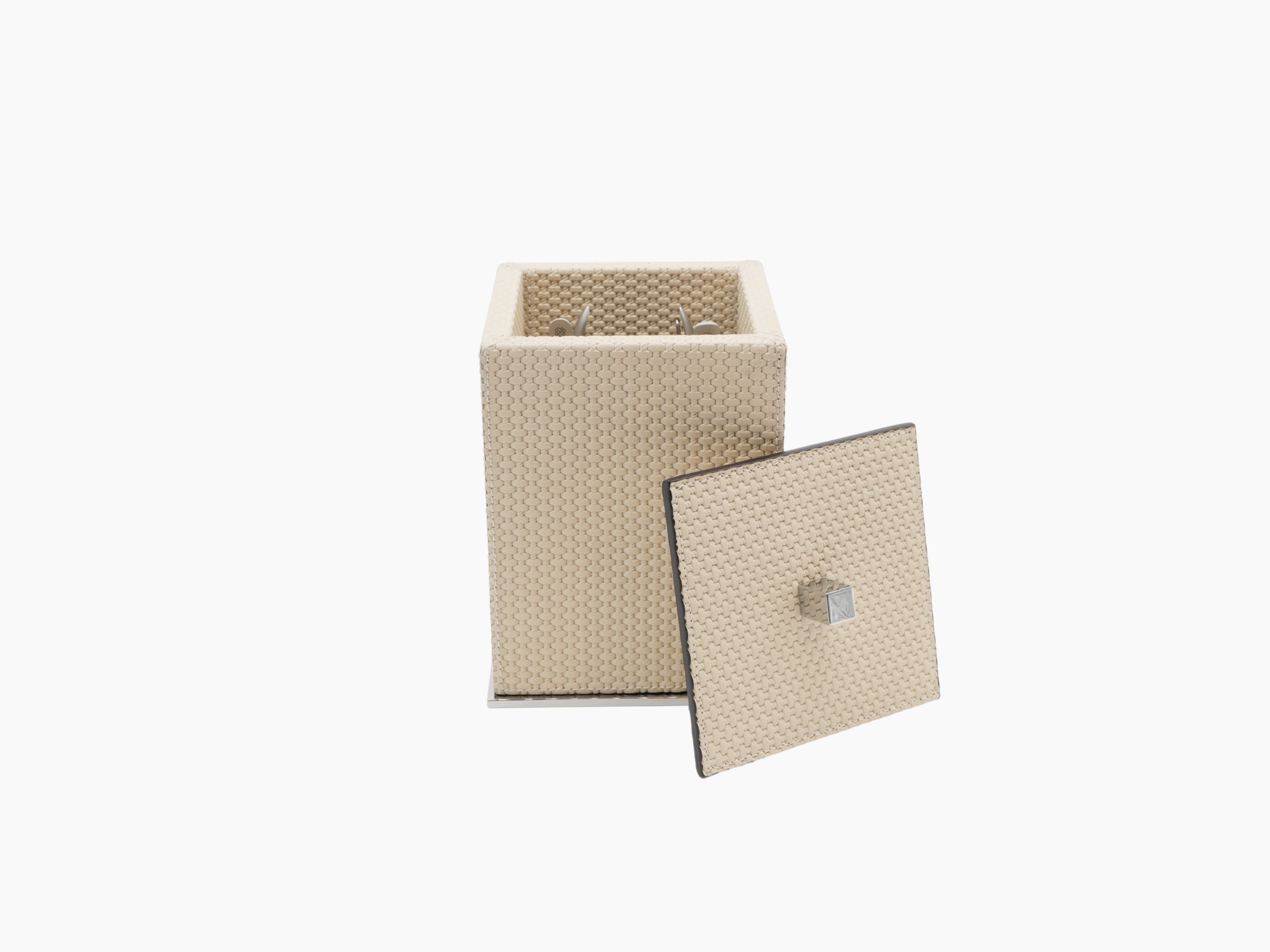 Open Firenze Manicure Set showing beige woven box with lid removed and metal tools inside.