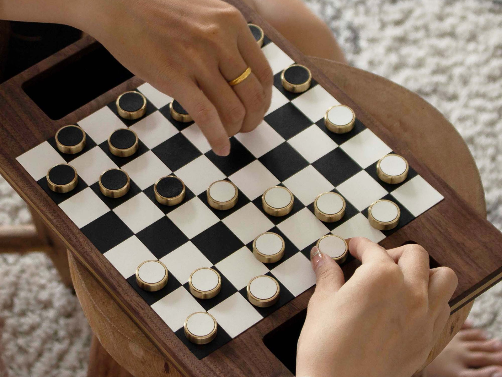Close up of Deluxe Magnetic Wooden Checker in use on a walnut board with magnetic discs