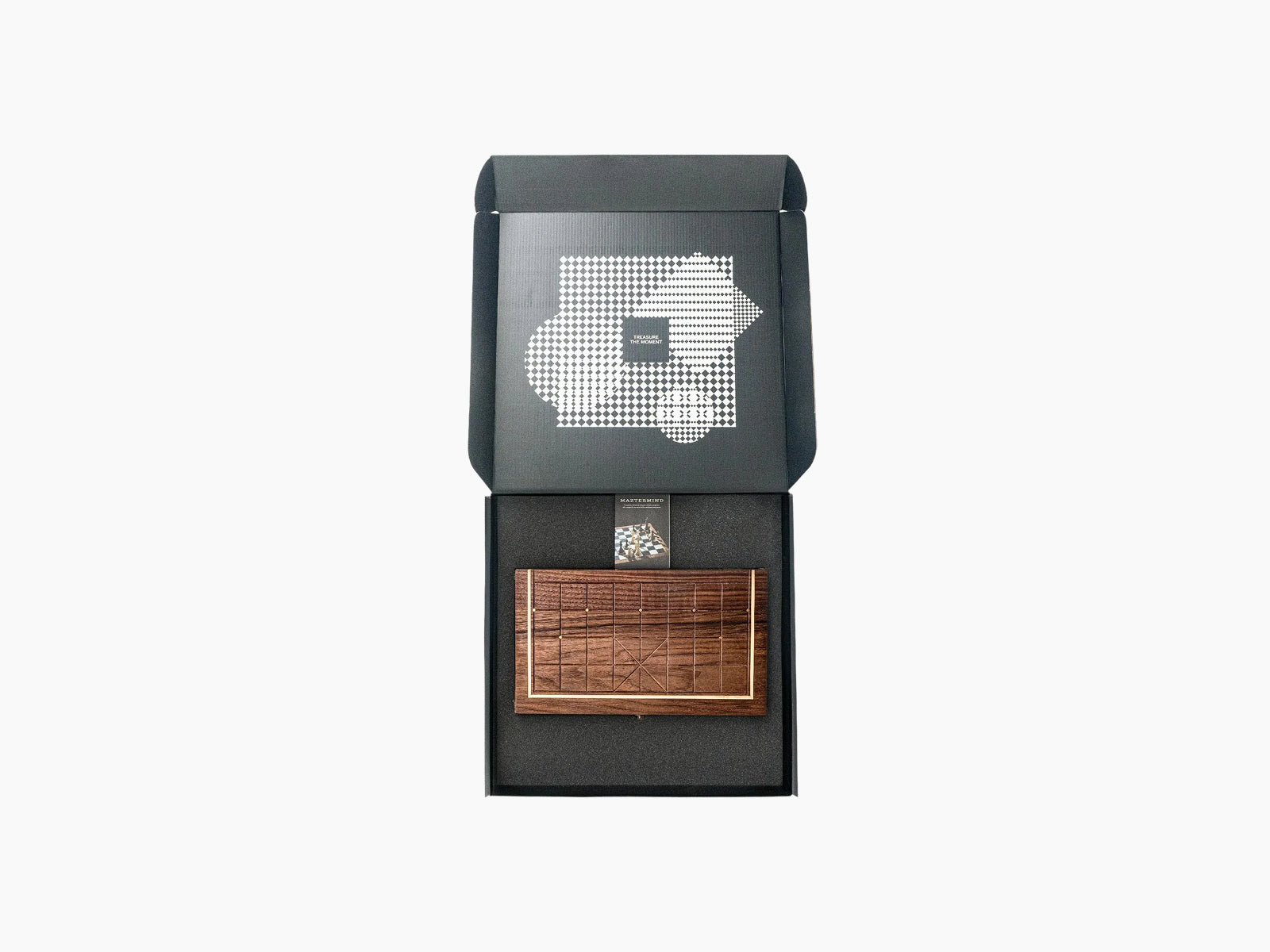 Open gift box revealing a walnut compact Chinese chess board nestled in foam.