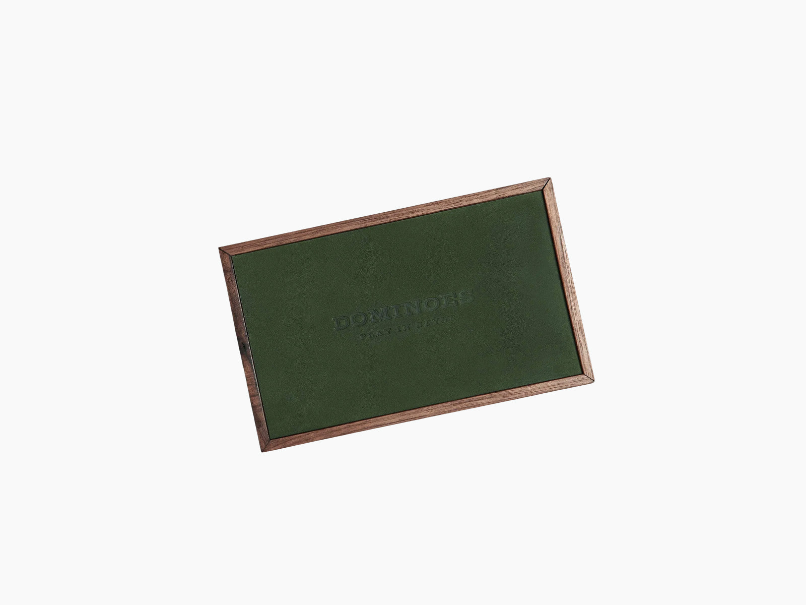 Brown leather domino tiles spill from a wooden box with a brown embossed lid reading DOMINOES