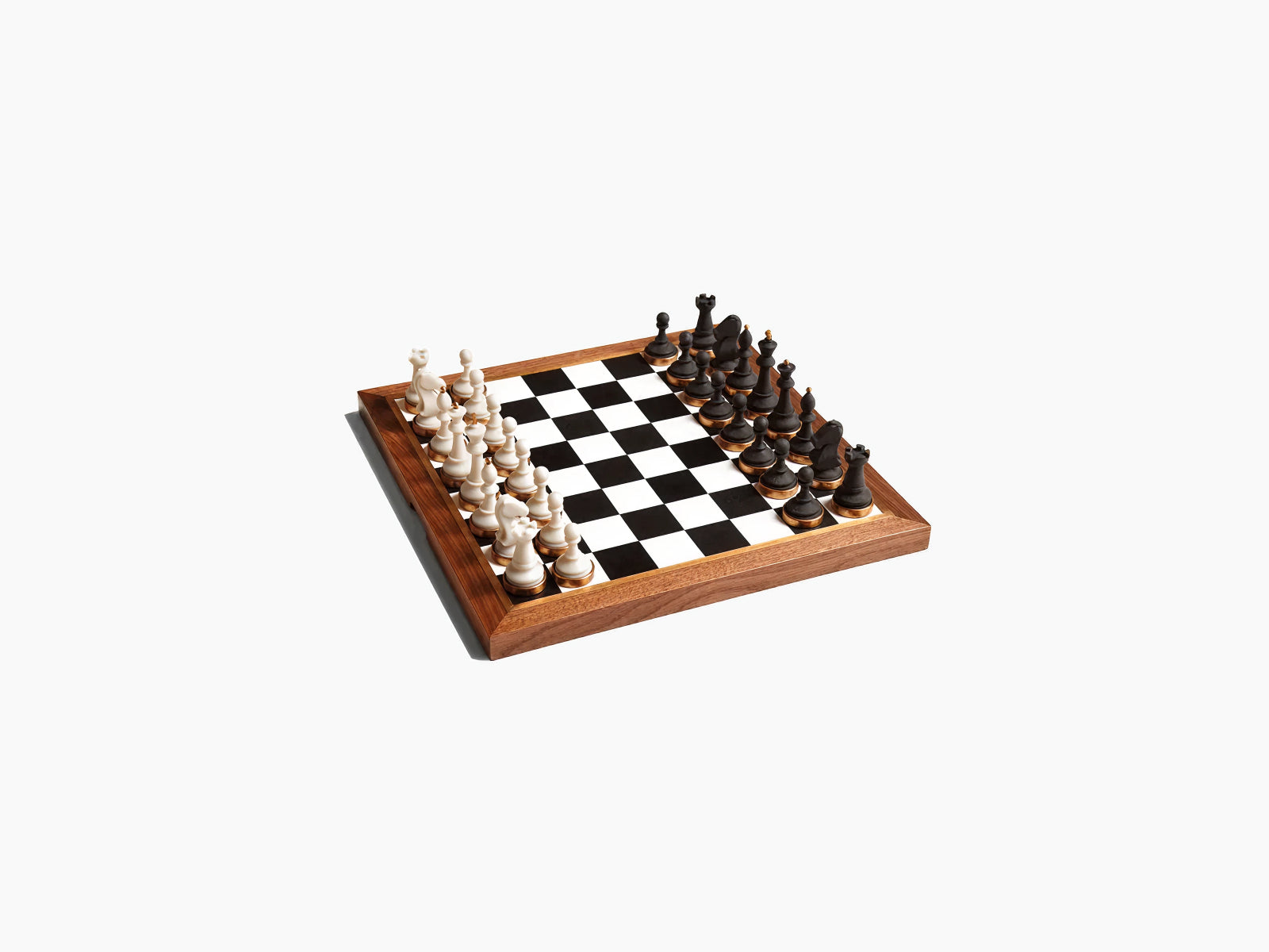 Luxurious walnut chess set on a wooden board with white pieces on the left and black pieces on the right angled shot