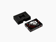 Black Memento Mori playing cards box with a cutout window beside the deck