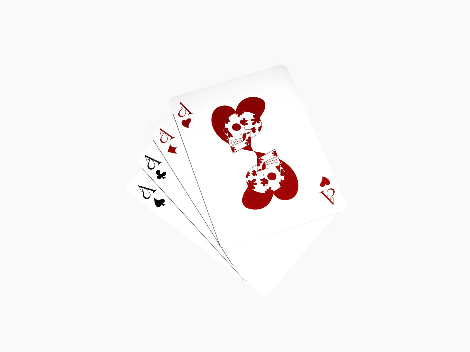 Close up of Memento Mori cards featuring skull artwork with red suit accents