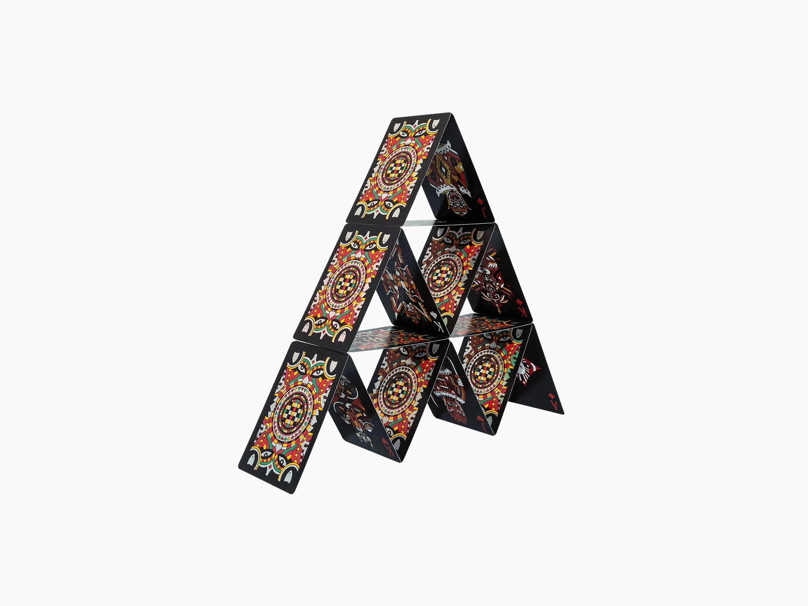 Ritual Masks playing cards stacked into a triangular tower showing vivid mask designs on their backs
