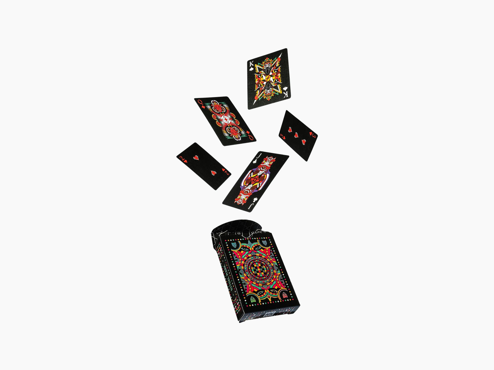 Ritual Masks playing cards floating above a black ornate deck box with vibrant mask illustrations.