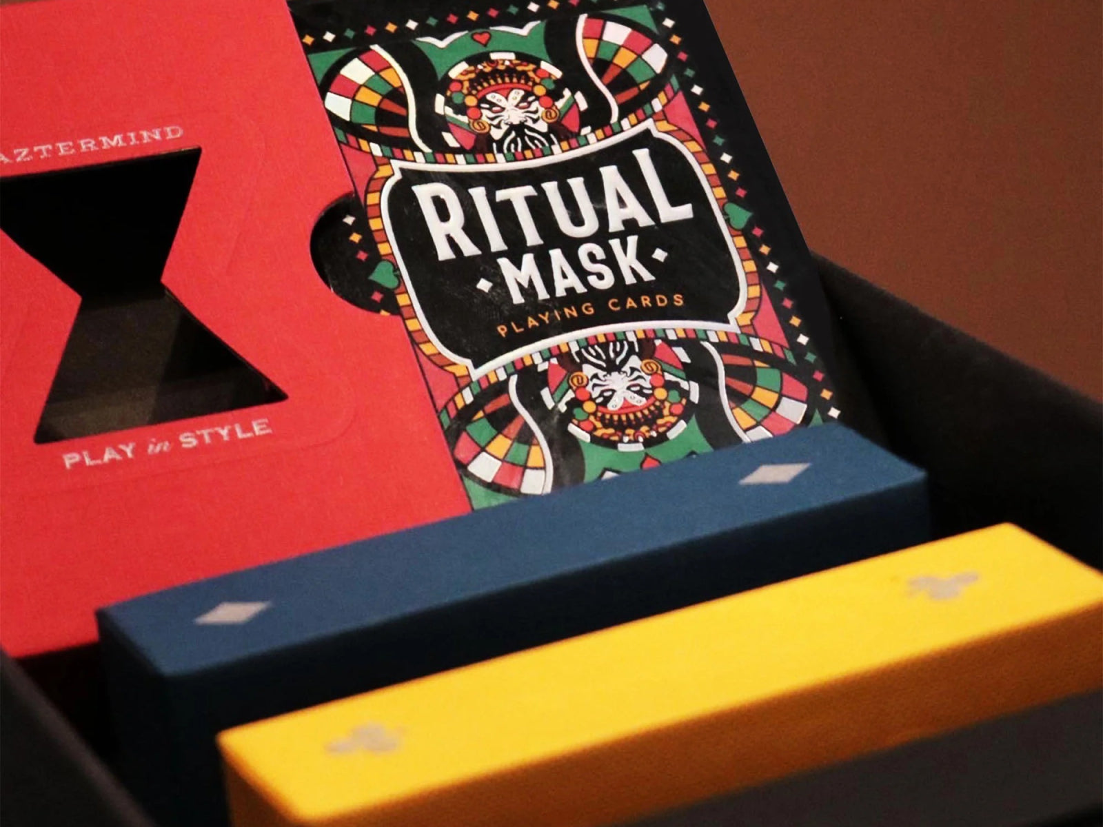 Red Ritual Masks playing cards box featuring bold title and vivid artwork.