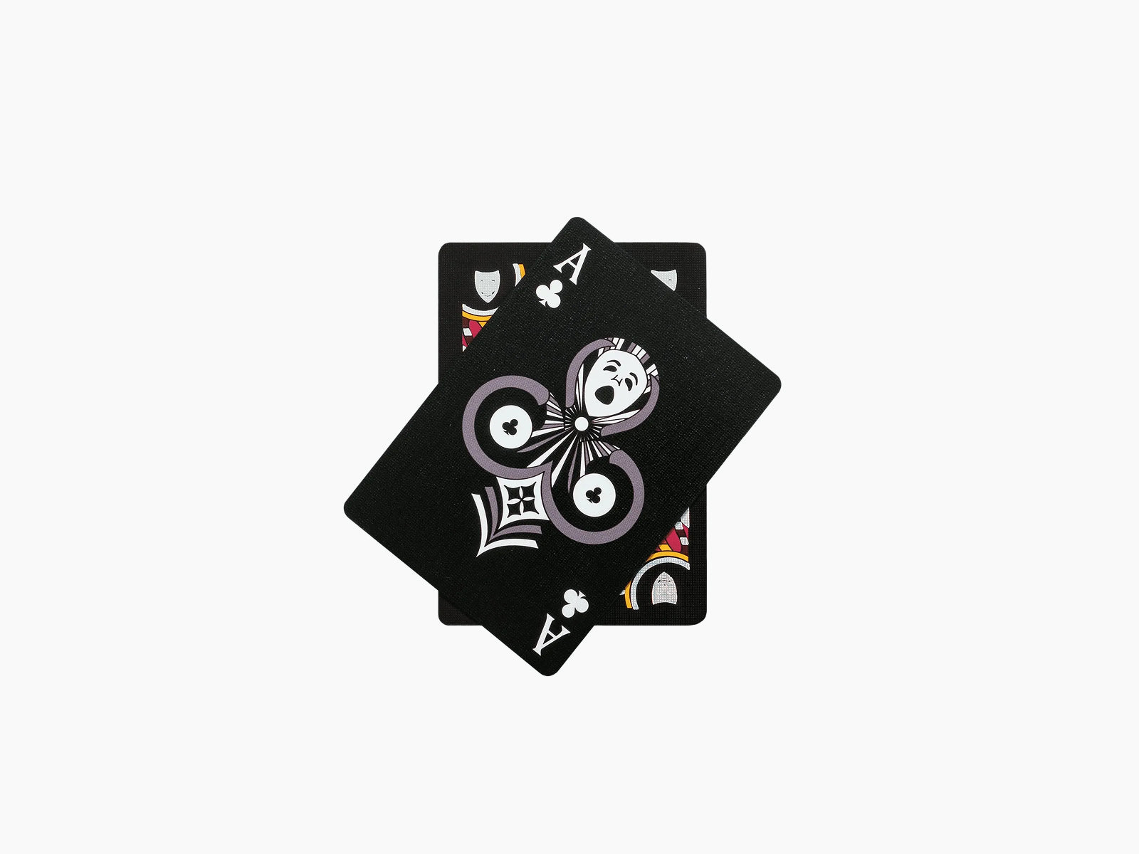 Ritual Masks playing cards deck with black backs stacked; top card shows a purple circular mask design.