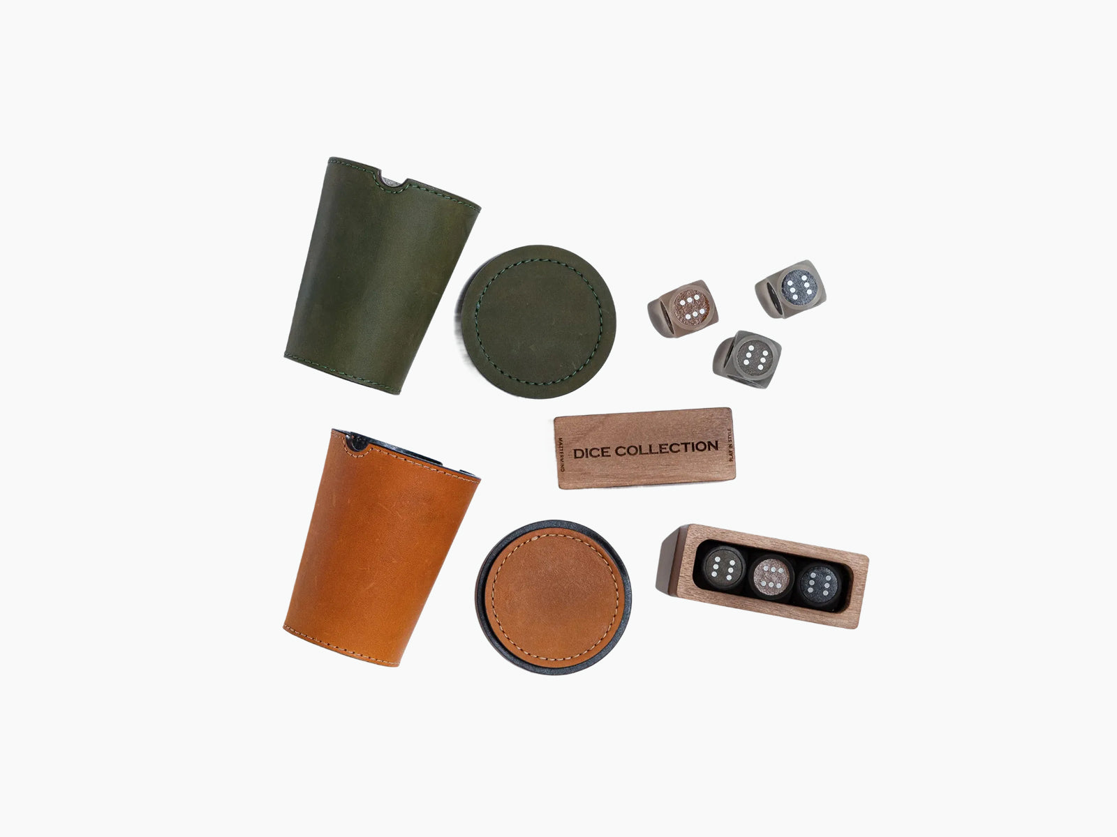 Green leather dice cup with tan shaker and a wooden dice tray holding three dice.