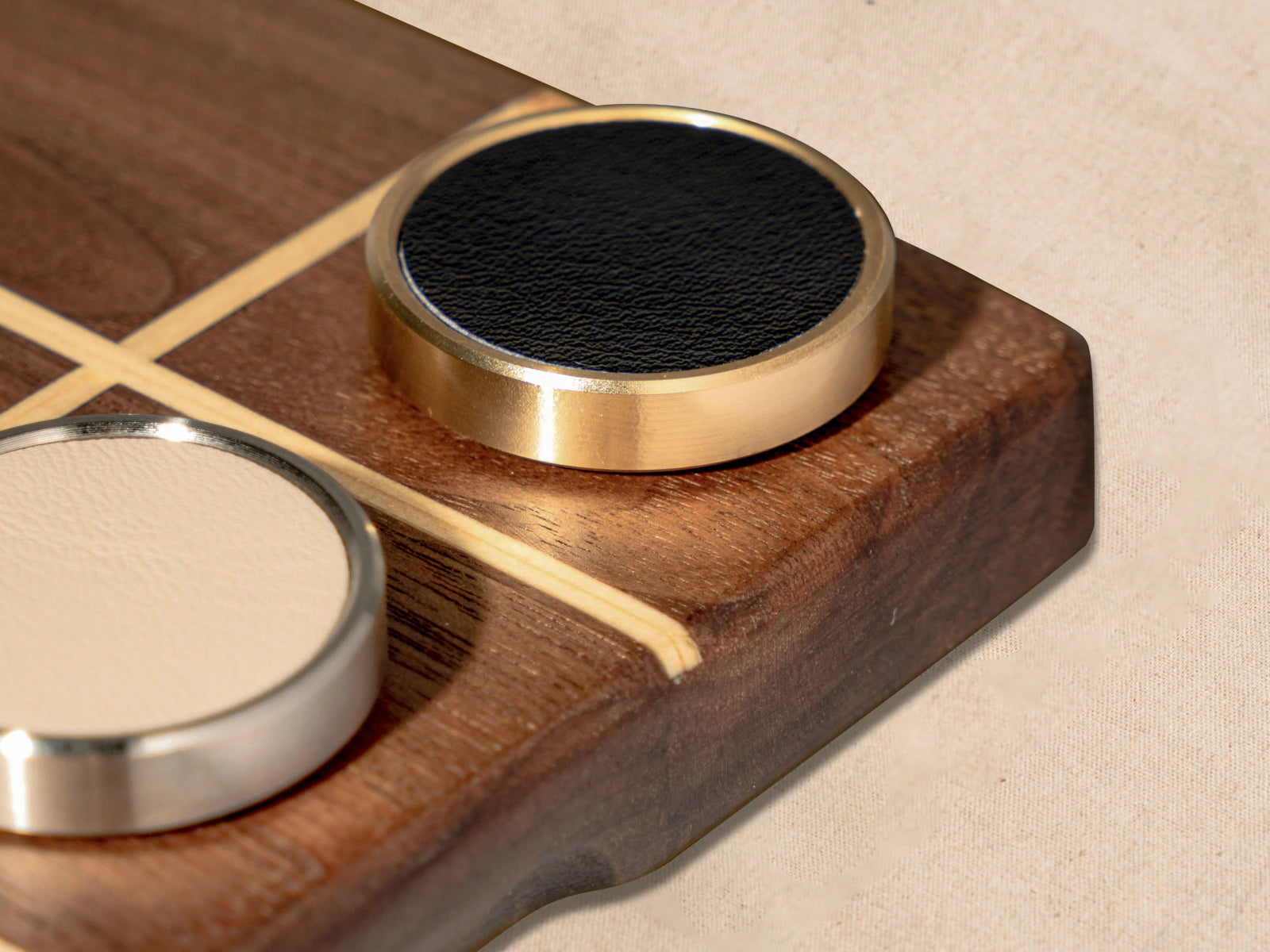 Premium Tic Tac Toe board crafted from walnut and pine with soft microfiber leather tokens and gleaming metal accents
