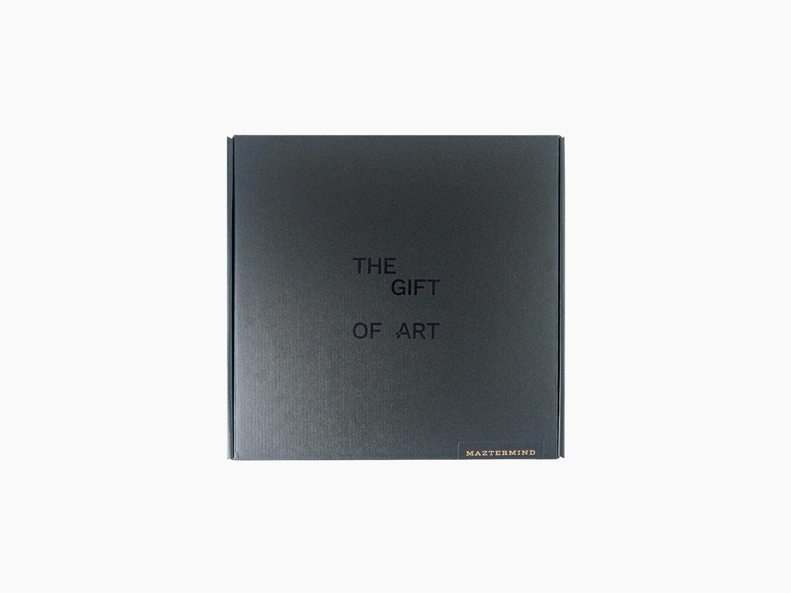Dark gift box with The Gift of Art inscription and Maztermind label in the corner