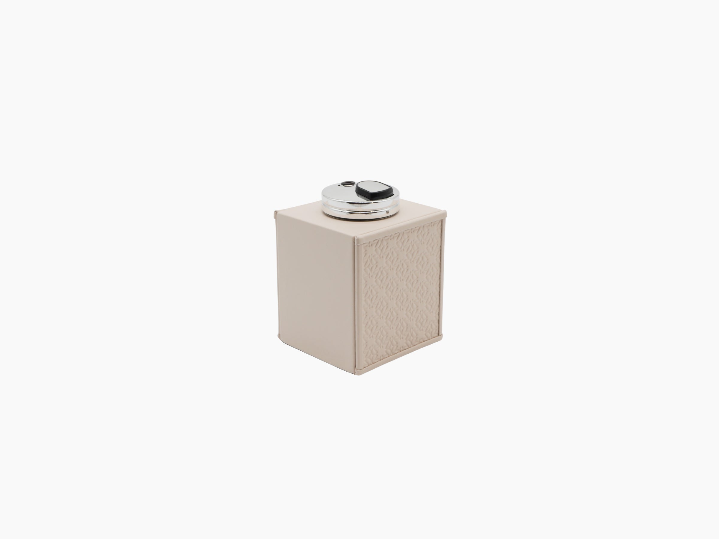 Monogram Table Lighter shown from front in cream leather embossed with Elie Saab monogram and a polished palladium top.
