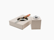 Beige Monogram Table Set opened showing a chrome ashtray and a resting cigar beside the lighter cube.