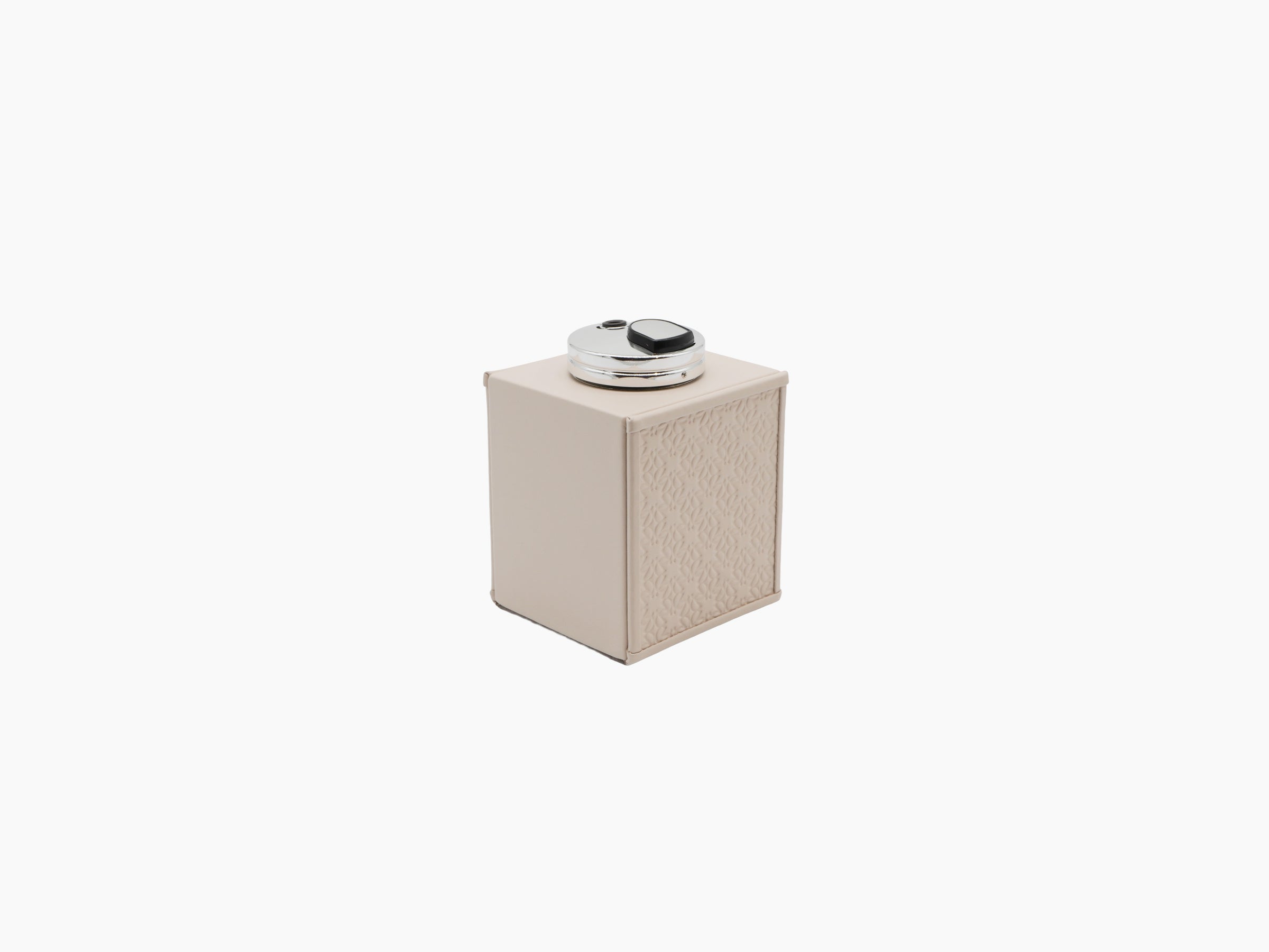 Beige padded leather ashtray and table lighter from the Monogram Table Set with palladium accents.