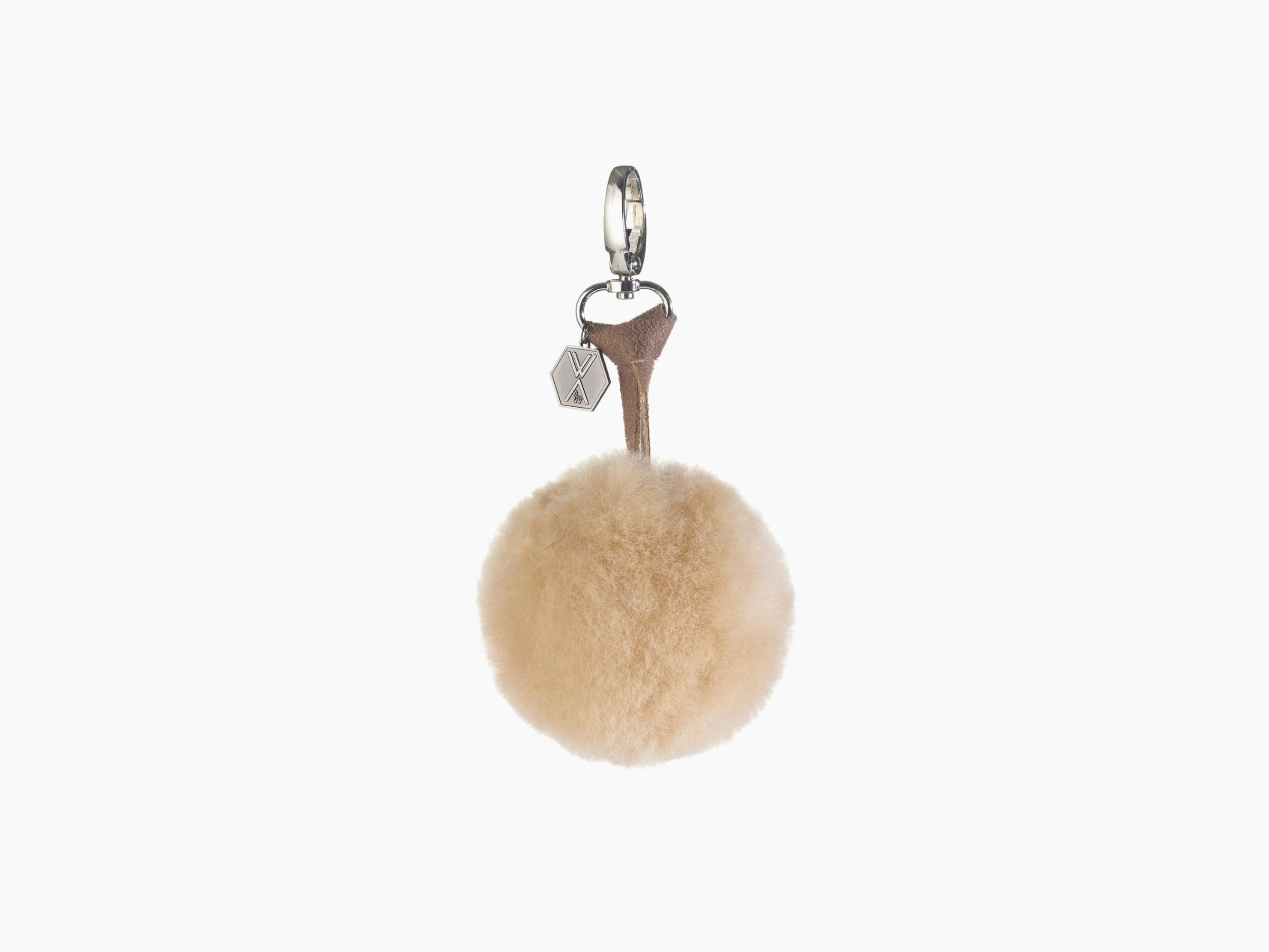Beige fluffy pompom CLAVE keychain attached to a brown leather strap with a silver ring and hex charm.