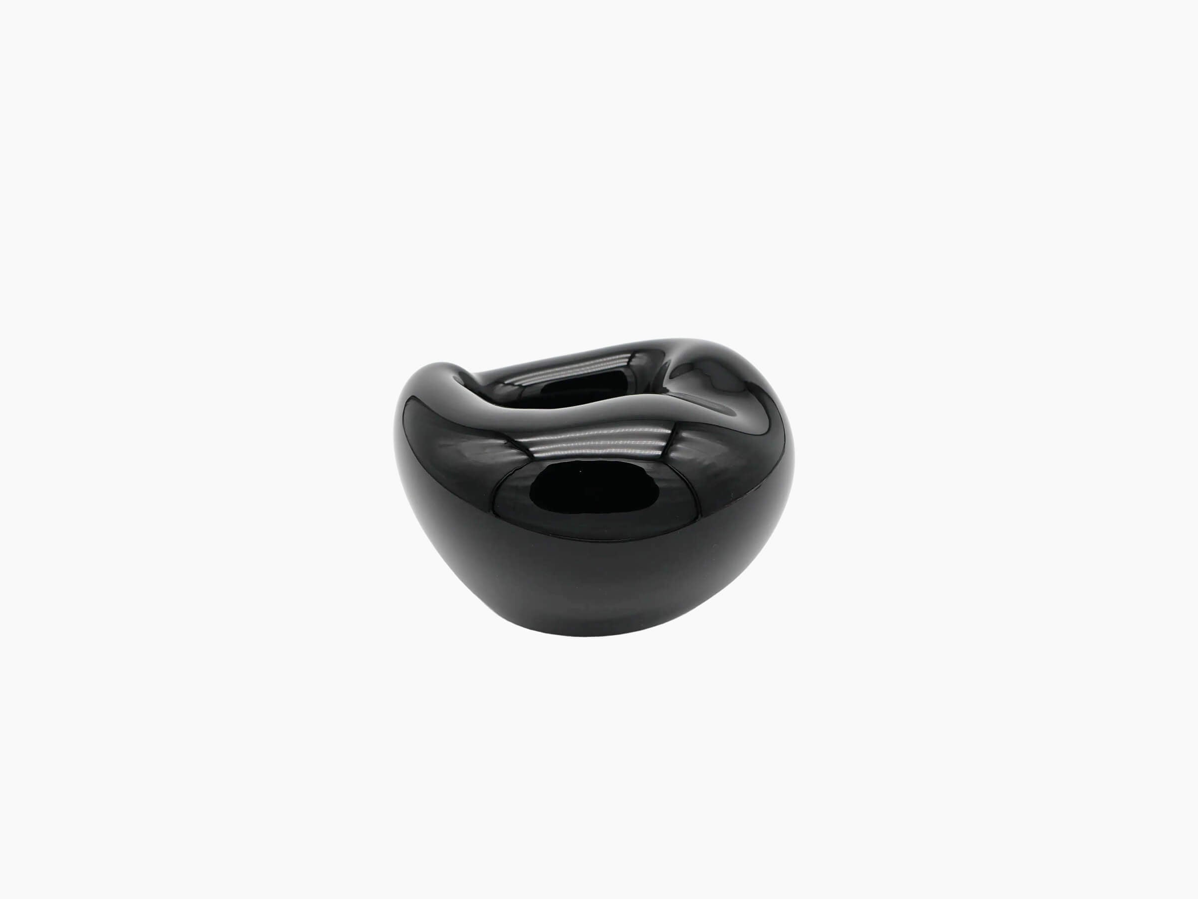 Small obsidian black hand blown glass vessel with a smooth glossy finish and a rounded body viewed head on.