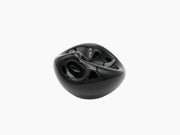 Hand-blown obsidian black glass vessel with a glossy sculptural form