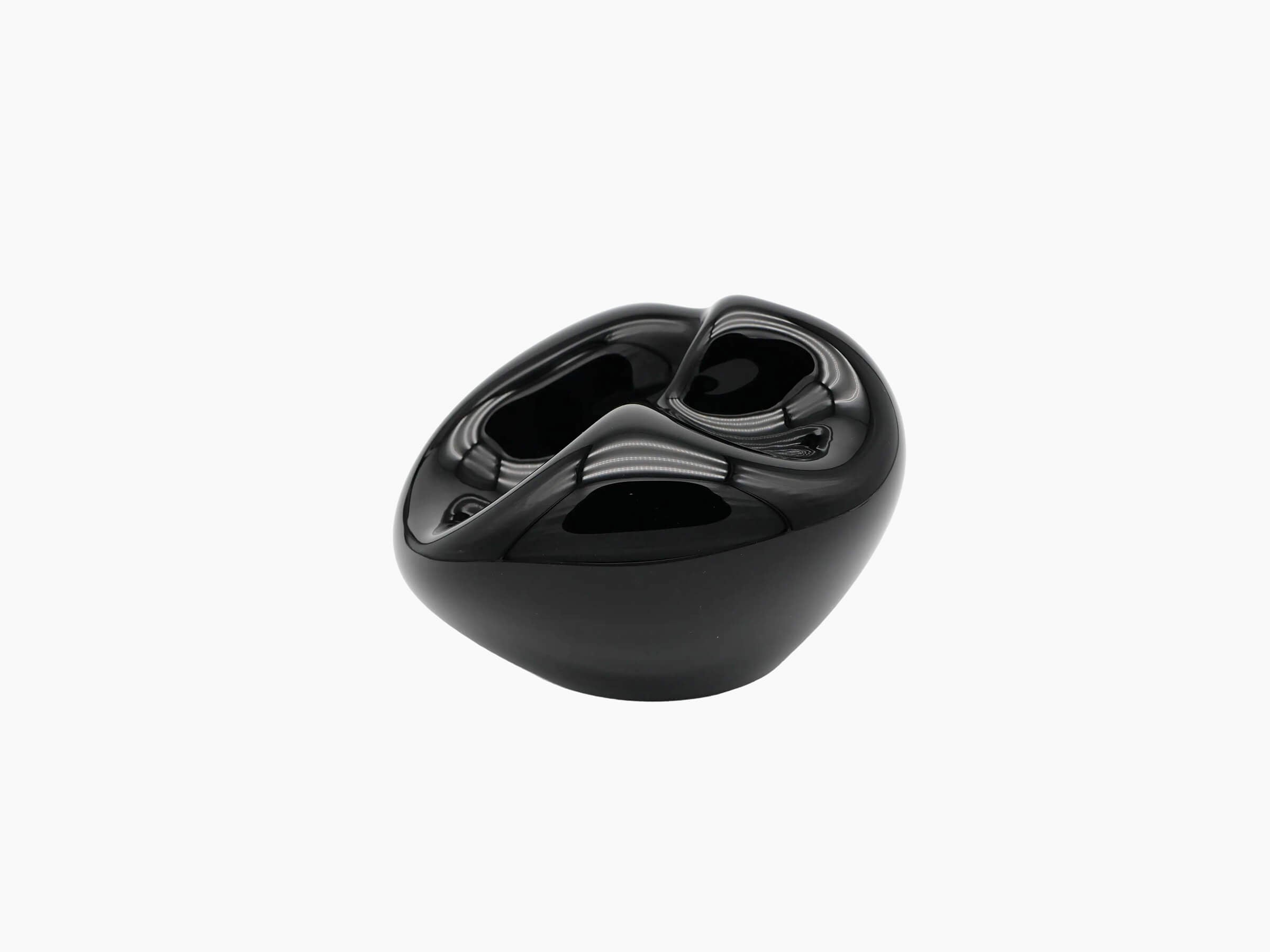 Hand blown Vessel Large in obsidian black with a rounded sculptural shape and a twisted glossy interior opening