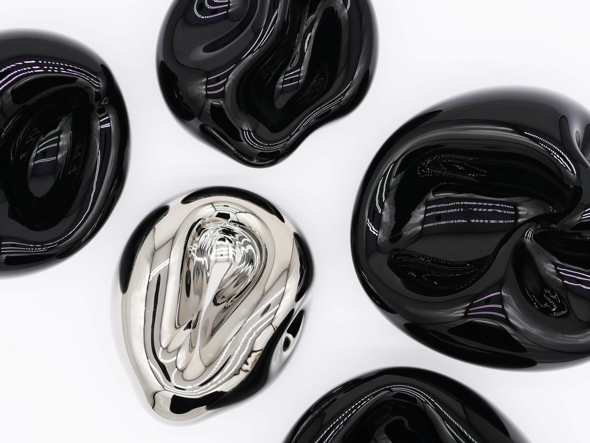 Group of glossy Vessel Small Obsidian Black glass forms arranged in a circular layout