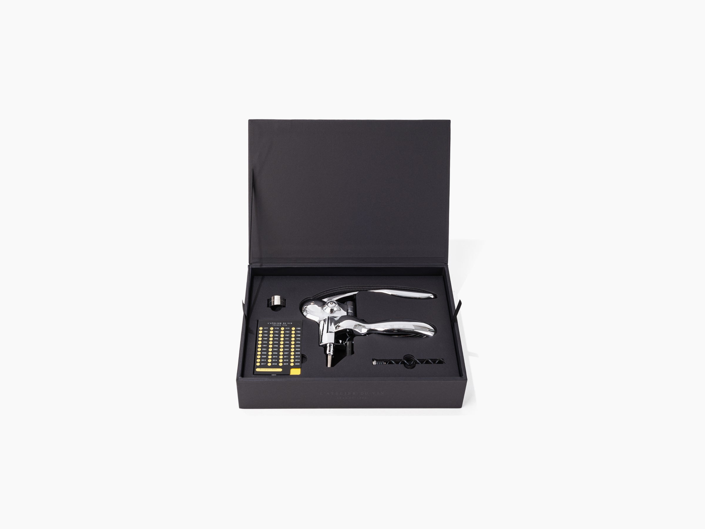 Oeno Box Sommelier set displayed in a black box with a chrome lever corkscrew and accessories