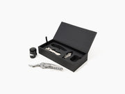 Oeno Collection 3 compact wine toolset displayed in an open black box with a lever corkscrew and accessories.