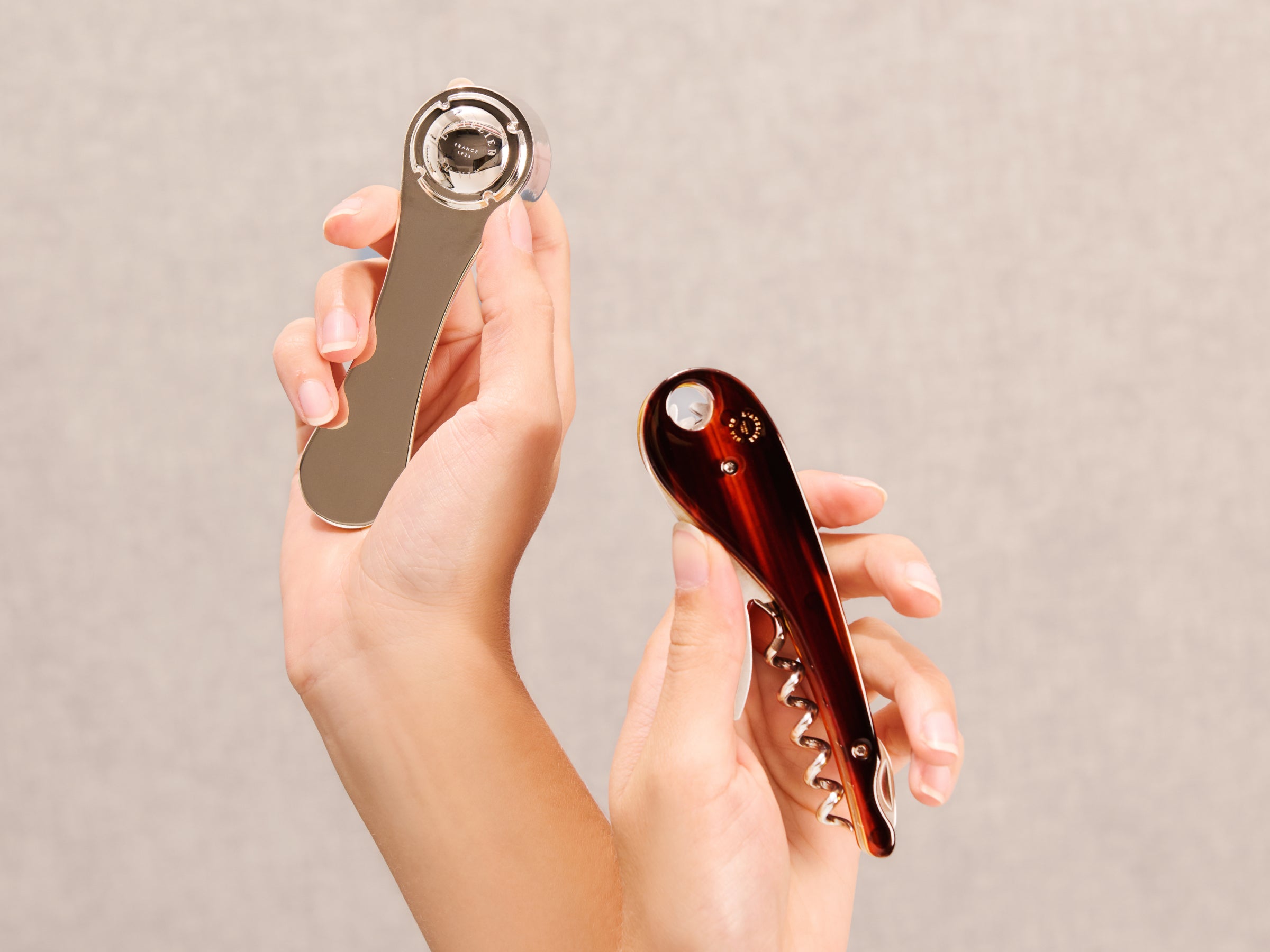 Oeno Collection 4 lever and brown tortoiseshell corkscrew held in hands