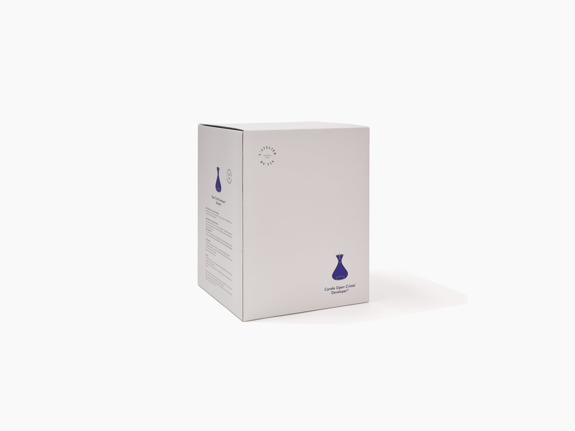Box packaging for Open Cristal Developer Soufflée bouche featuring a blue decanter illustration.