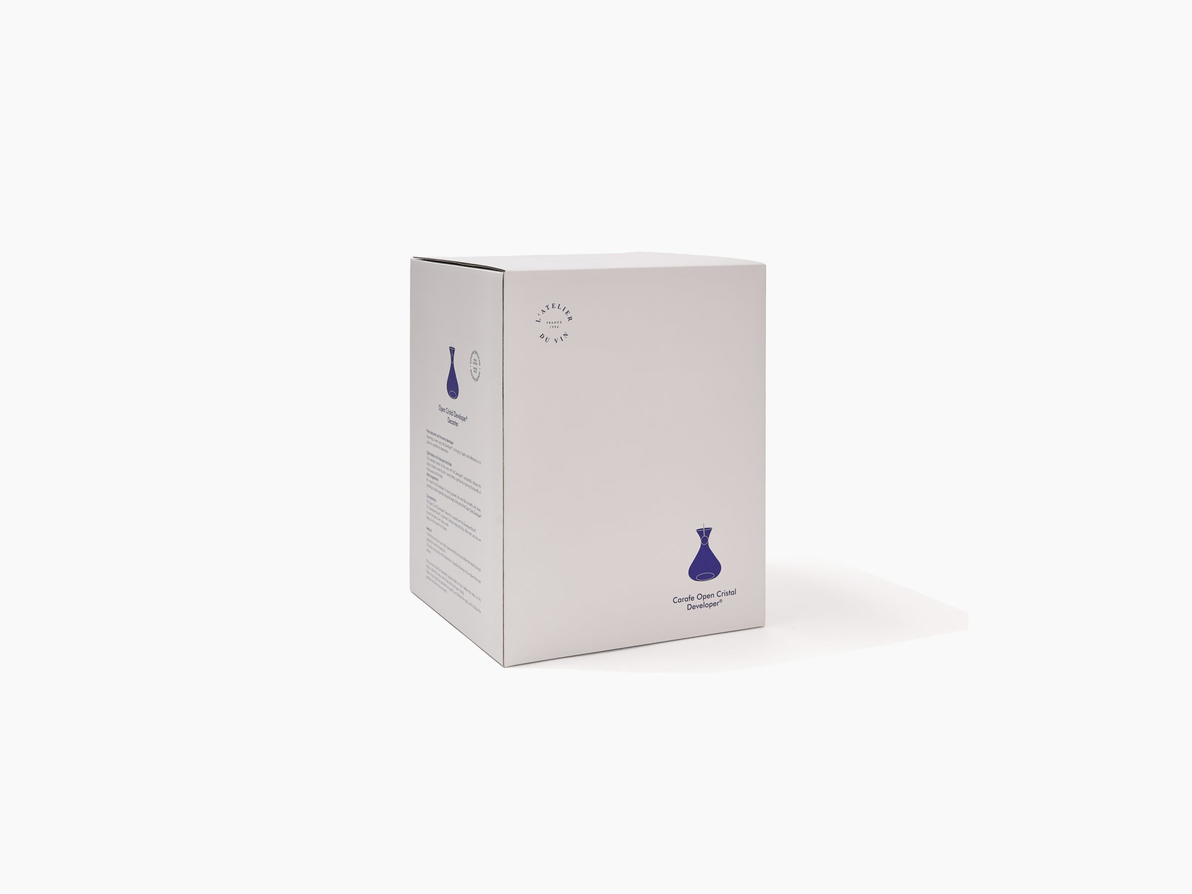 Box packaging for Open Cristal Developer Soufflée bouche featuring a blue decanter illustration.