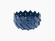Almeria Round Emptypockets towel basket woven from blue leather strips with chrome fittings.