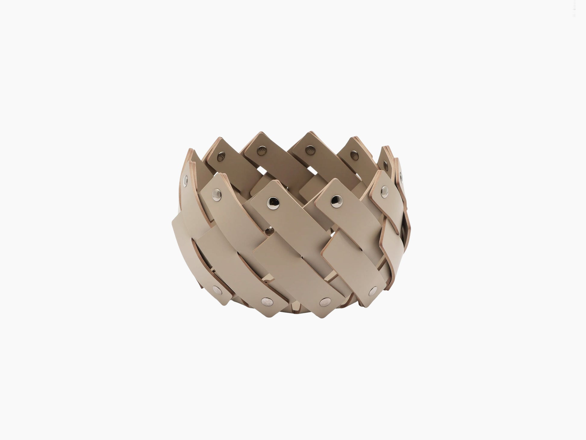 Round towel basket woven from beige leather strips with polished chrome fittings