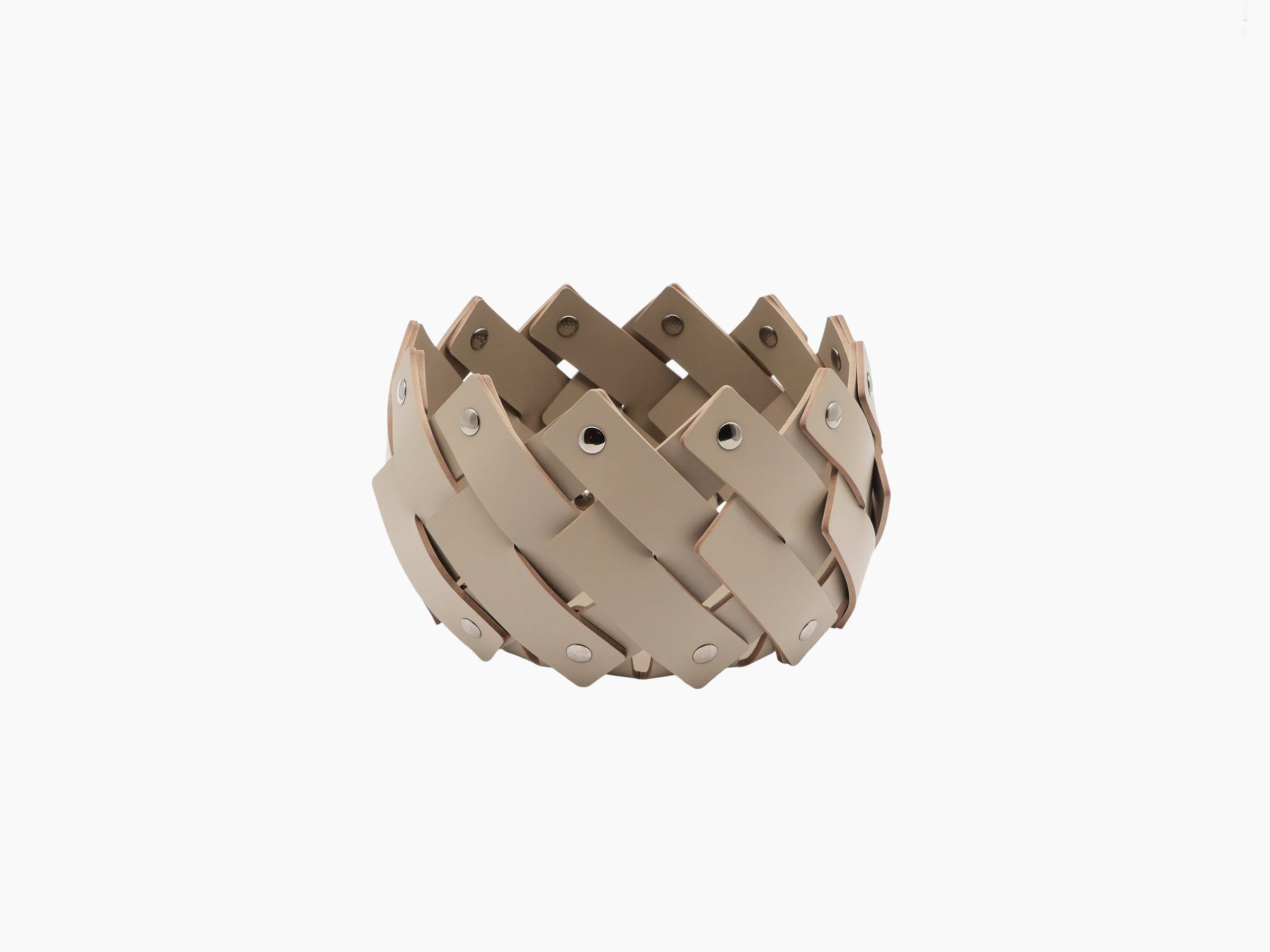 Round towel basket woven from beige leather strips with polished chrome fittings