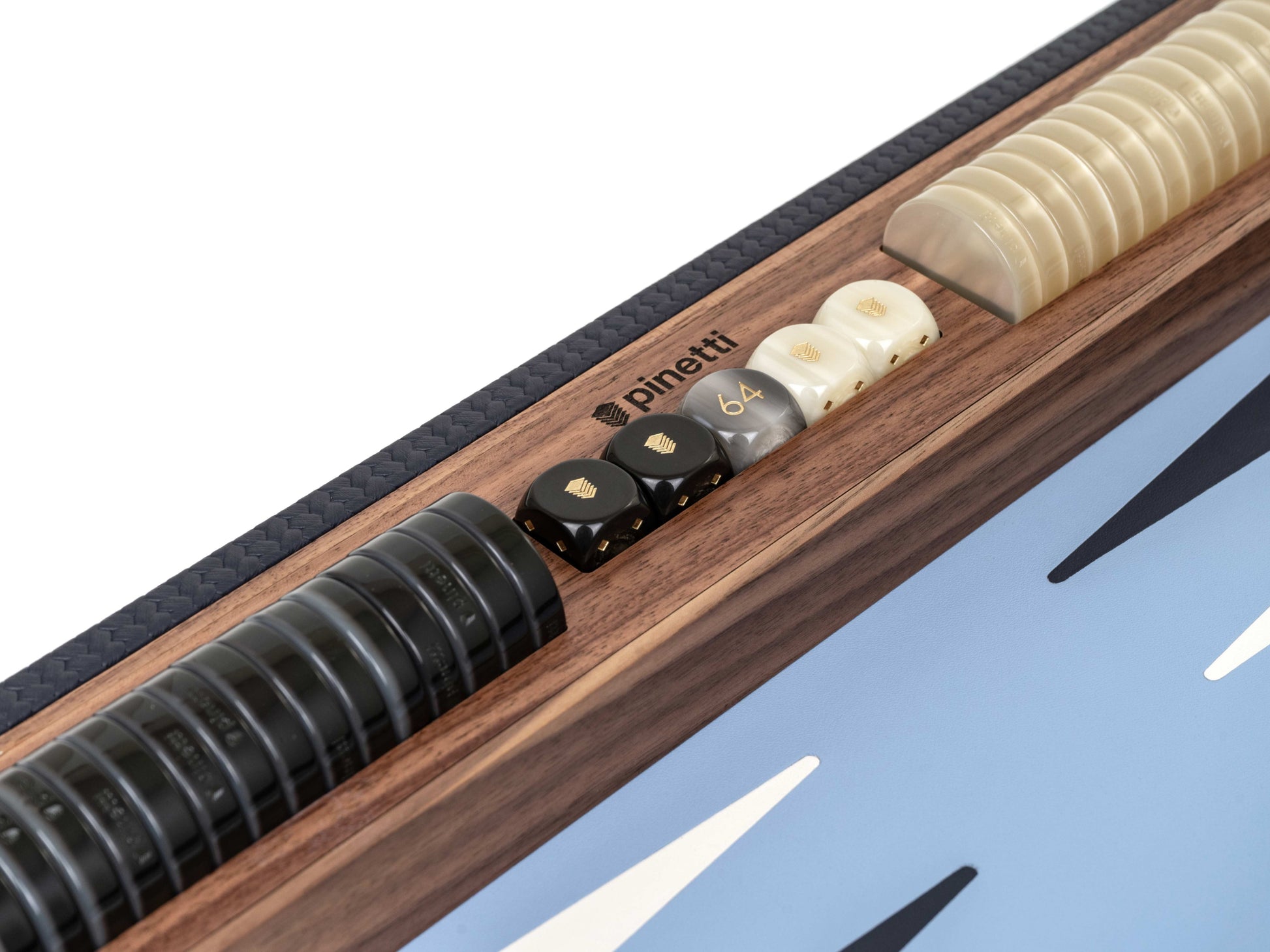 Close-up of walnut backgammon tray with braided leather edge and blue playing surface showing black checkers ivory pearled pawns and curved ivory discs.