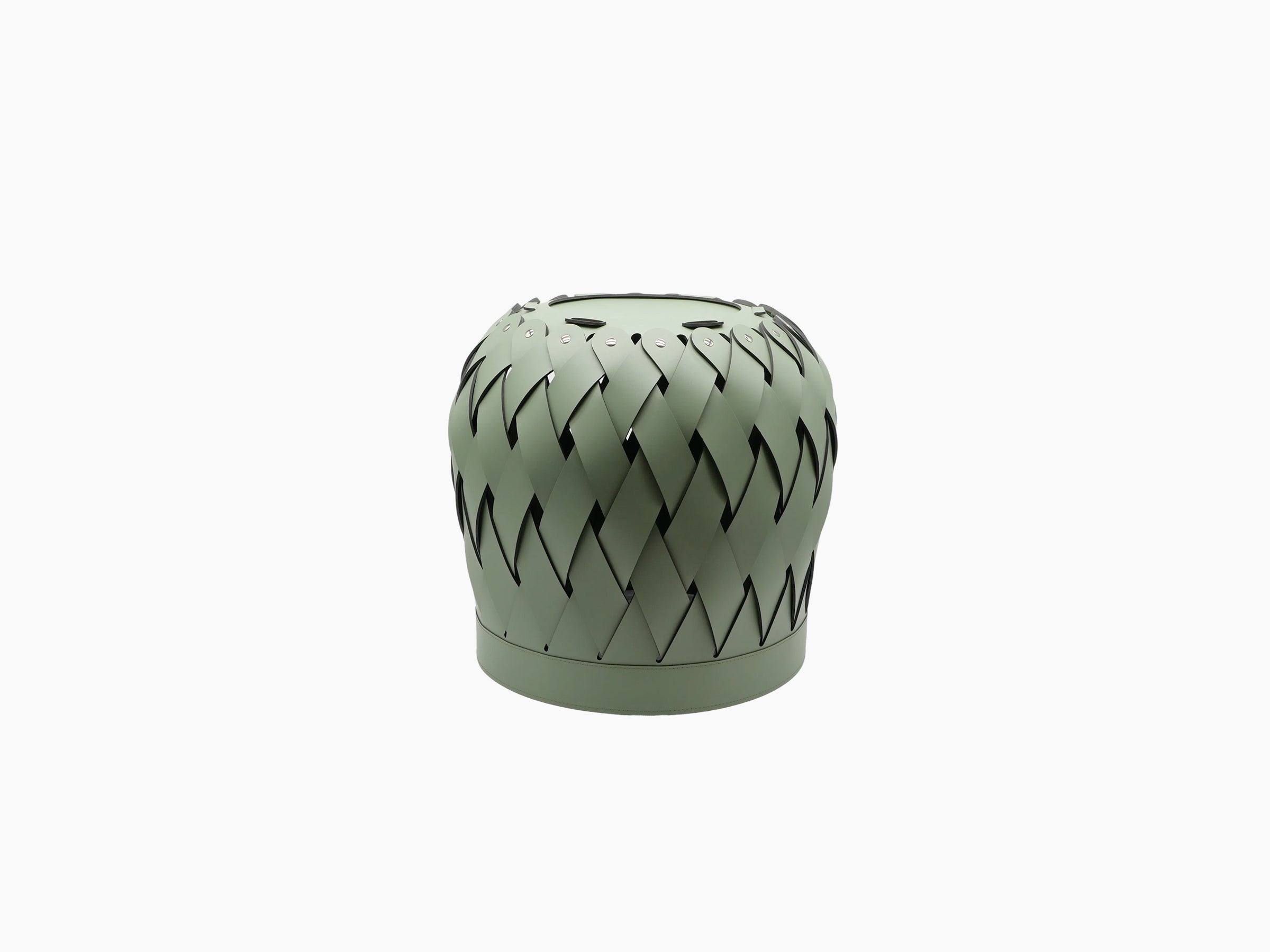 Round Canaria basket with multi tone leather weave, a fluffy bunny peeking over the rim and a beige throw draped over the edge